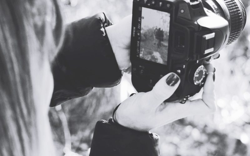 close-up-woman-photographing-from-camera