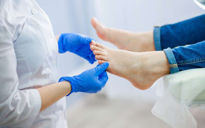 Podiatry doctor examines the foot